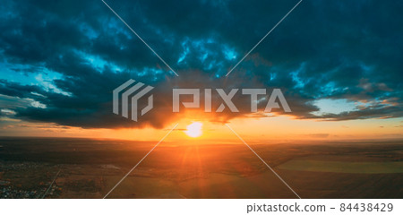 Aerial View Of Sunshine In Sunrise Bright Dramatic Sky. Scenic Colorful Sky At Dawn. Sunset Sky Above Autumn Field And Meadow, Forest Landscape In Evening. Top View From High Attitude 84438429