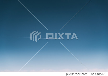 Contrail In Blue Sky. Plane In Sunny Sky. Aircraft In Sky With Plane Trail. View From High Height Flight Of Plane. Travel And Transportation Concept Contrail In Blue Sky. Plane In Sunny Sky. Aircraft In Sky With Plane Trail. View From High Height Flight Of Plane. Travel And Transportation Concept 84438563