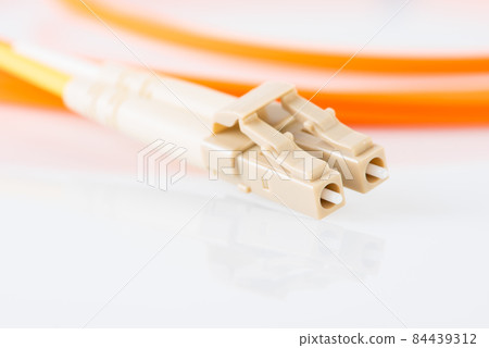 Fiber optical patch cord with LC plug connector close-up Fiber optical patch cord with LC plug connector close-up 84439312