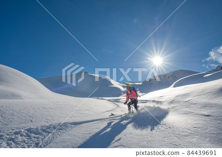 A skier with a learning technique off-piste 84439691