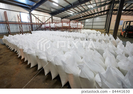 Many white bags in warehouse Many white bags in warehouse 84441630