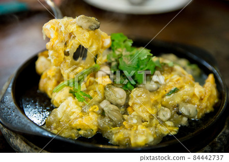 Top view of Raw Oysters fried in egg batter hot pan Top view of Raw Oysters fried in egg batter hot pan 84442737