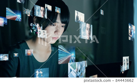 Woman watching a picture Woman watching a picture 84443662