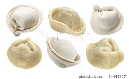 Cooked dumplings and raw pelmeni isolated on white background Cooked dumplings and raw pelmeni isolated on white background 84443827
