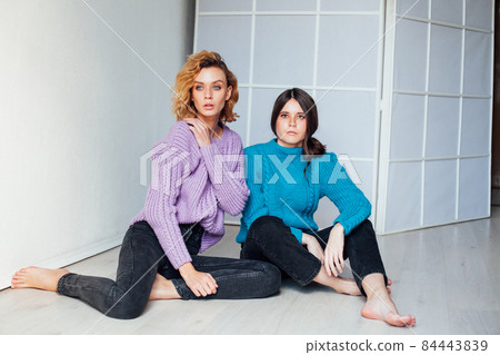 two beautiful fashionable women friends hugging nice two beautiful fashionable women friends hugging nice 84443839