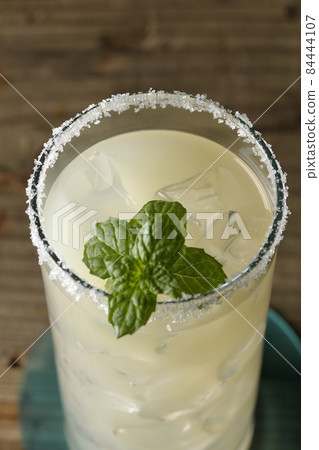 Salty dog with mint cocktail with salt on the edge of the glass Salty dog with mint cocktail with salt on the edge of the glass 84444107