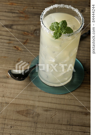 Salty dog with mint cocktail with salt on the edge of the glass Salty dog with mint cocktail with salt on the edge of the glass 84444244