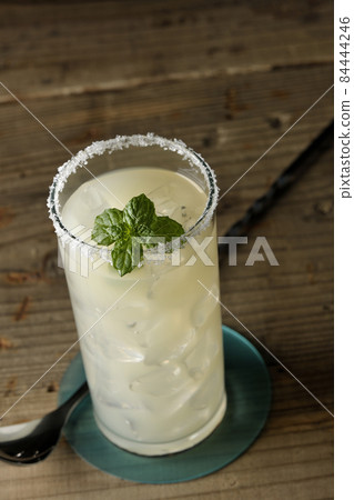 Salty dog with mint cocktail with salt on the edge of the glass Salty dog with mint cocktail with salt on the edge of the glass 84444246