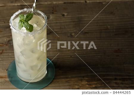 Salty dog with mint cocktail with salt on the edge of the glass Salty dog with mint cocktail with salt on the edge of the glass 84444265