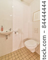 Interior of small clean restroom in miniature style 84444444