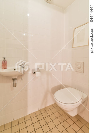Interior of small clean restroom in miniature style 84444444
