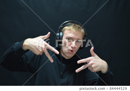 Caucasian DJ man who is exciting the event 84444529