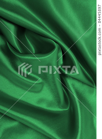 Smooth elegant green silk or satin luxury cloth texture as abstract background. Luxurious background design Smooth elegant green silk or satin luxury cloth texture as abstract background. Luxurious background design 84445897