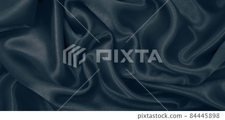 Smooth elegant dark grey silk or satin luxury cloth texture as abstract background. Luxurious background design Smooth elegant dark grey silk or satin luxury cloth texture as abstract background. Luxurious background design 84445898