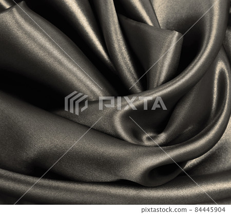Smooth elegant brown silk or satin texture as abstract background. Luxurious background design. In Sepia toned. Retro style Smooth elegant brown silk or satin texture as abstract background. Luxurious background design. In Sepia toned. Retro style 84445904