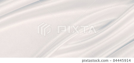 Smooth elegant grey silk or satin luxury cloth as wedding background. Luxurious background design Smooth elegant grey silk or satin luxury cloth as wedding background. Luxurious background design 84445914