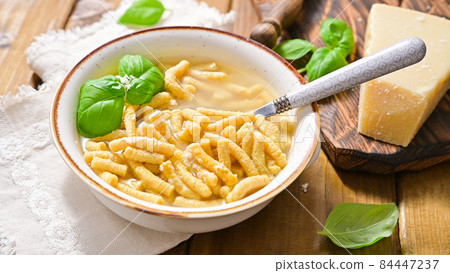 Italian soup. Parmesan Pasta Passatel. Traditional Italian food from the northern regions. Italian soup. Parmesan Pasta Passatel. Traditional Italian food from the northern regions. 84447237