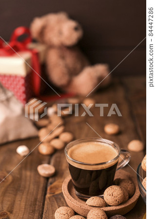 Dutch holiday Sinterklaas. kruidnoten cookies sweets, chocolate and a gift for the child. Children 84447286