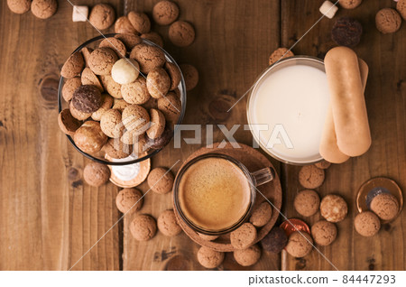 Dutch holiday Sinterklaas. kruidnoten cookies sweets, chocolate and a gift for the child. Children 84447293