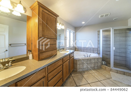 Bathroom interior with tiles and double vanity sink 84449062
