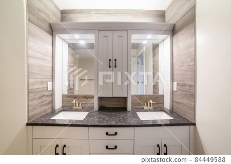 Alcove double vanity sink with wood panel walls and cabinet Alcove double vanity sink with wood panel walls and cabinet 84449588