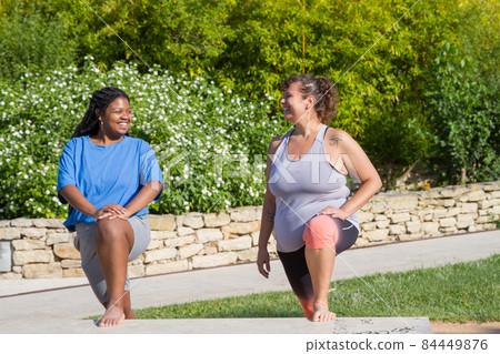 Beaming plus size women doing sports Beaming plus size women doing sports 84449876