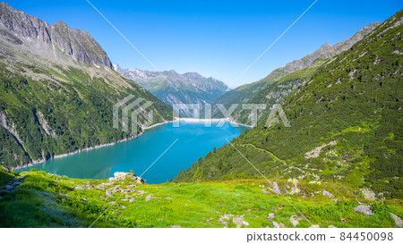 Beautiful alpine walley with azure blue water dam Beautiful alpine walley with azure blue water dam 84450098