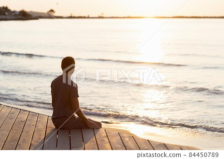 man meditating beach. High quality photo man meditating beach. High quality photo 84450789