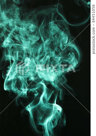 fluffy puffs green smoke fog black background. High quality photo fluffy puffs green smoke fog black background. High quality photo 84451056