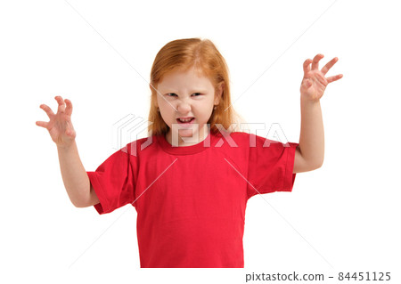 Portrait of cute redhead emotional little girl isolated on a white trying to scare someone Portrait of cute redhead emotional little girl isolated on a white trying to scare someone 84451125