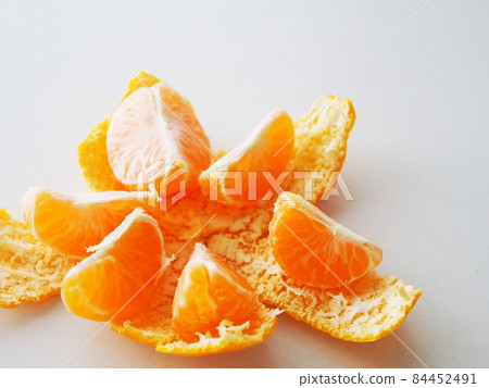 Peeled and divided tangerines Peeled and divided tangerines 84452491