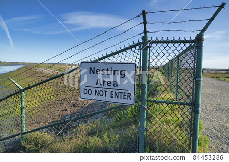Nesting Area Do Not Enter sign at Bolsa Chica Ecological Reserve California 84453286
