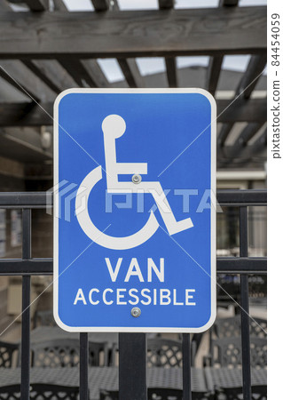 Portrait of a handicapped parking accessibility signage Portrait of a handicapped parking accessibility signage 84454059