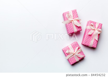 Valentine day composition: red gift box with bow and heart. Christmas present. View from above. Space for text. Holday greeting card 84454232