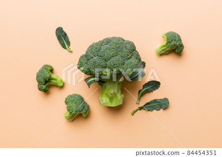 green fresh broccoli background close up on colored table. Vegetables for diet and healthy eating. Organic food 84454351