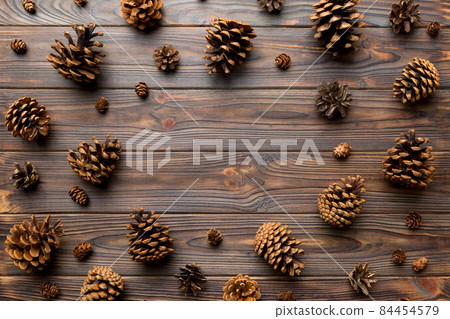 minimal creative cone frame arrangement pattern on colored background . flat lay, top view. christmas background with copy space minimal creative cone frame arrangement pattern on colored background . flat lay, top view. christmas background with copy space 84454579