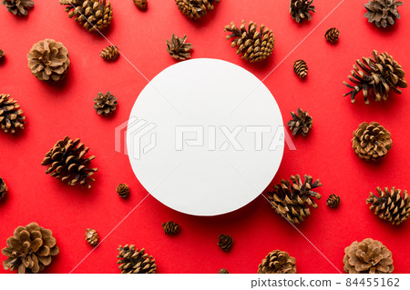 Creative frame made of Christmas pine cones with square Paper blank. Xmas and New Year theme. Flat lay, top view copy space 84455162