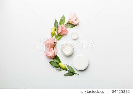 Composition with cosmetic products and beautiful roses on white background. Copy space, flat lay Composition with cosmetic products and beautiful roses on white background. Copy space, flat lay 84455223