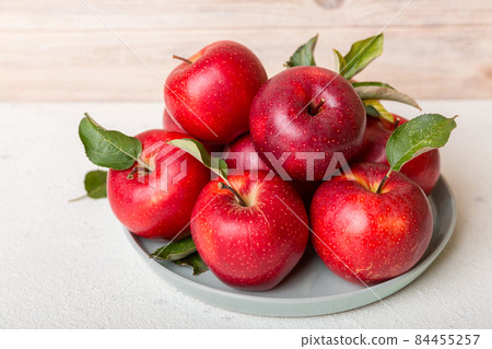 juicy red apples in a bowl or plate on the table top view. Copy space juicy red apples in a bowl or plate on the table top view. Copy space 84455257