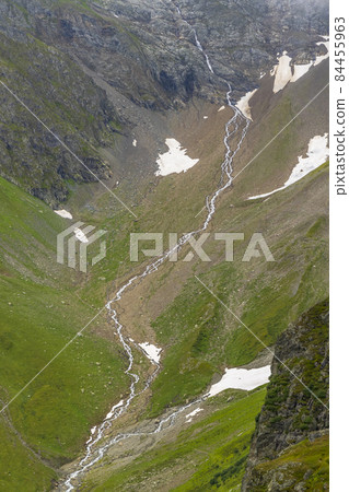 Typical alpine landscape of Swiss Alps near Sustenstrasse, Urner Alps, Canton of Bern, Switzerland 84455963