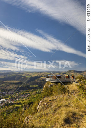 Look-out with Millau Viaduct across gorge valley of Tarn River, Aveyron Departement, France Look-out with Millau Viaduct across gorge valley of Tarn River, Aveyron Departement, France 84455969