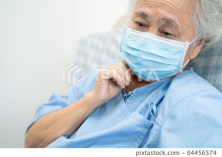 Asian senior or elderly old lady woman patient worry and wearing a face mask new normal in hospital for protect safety infection Covid-19 Coronavirus. Asian senior or elderly old lady woman patient worry and wearing a face mask new normal in hospital for protect safety infection Covid-19 Coronavirus. 84456574