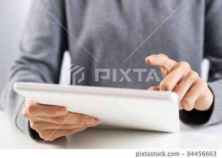 Woman using digital tablet computer 84456663