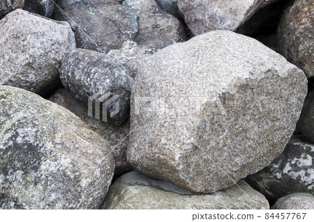 Rockfall on the road in the mountains. Stones of different sizes. Landslides. 84457767