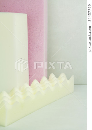 a piece of foam rubber of different sizes and colors, production of upholstered furniture. a piece of foam rubber of different sizes and colors, production of upholstered furniture. 84457769