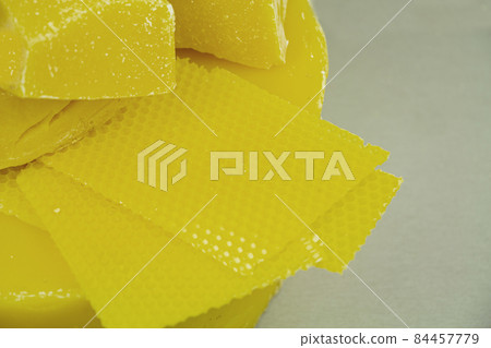 large pieces of natural beeswax, close-up, raw materials for candles. large pieces of natural beeswax, close-up, raw materials for candles. 84457779