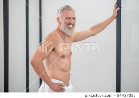 Smiling topless man posing looking at camera Smiling topless man posing looking at camera 84457885
