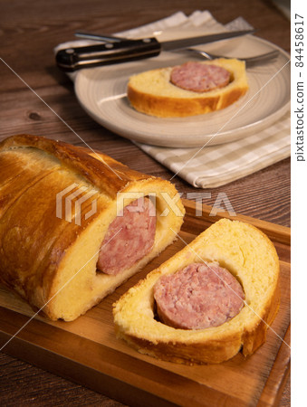Lyonnais brioche baked with sausage style rustic, Morteau sausage Lyonnais brioche baked with sausage style rustic, Morteau sausage 84458617