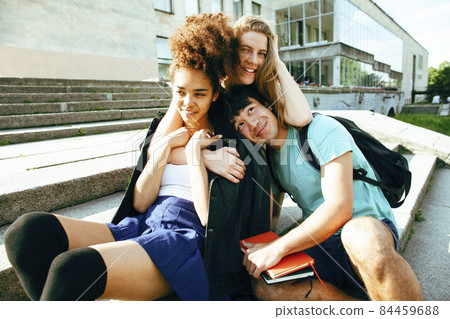 cute group of teenages at the building of university with books huggings, diversity nations, having lunch cute group of teenages at the building of university with books huggings, diversity nations, having lunch 84459688