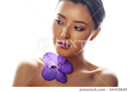 young pretty asian woman with flower purple orchid isolated on white background, spa people concept young pretty asian woman with flower purple orchid isolated on white background, spa people concept 84459689
